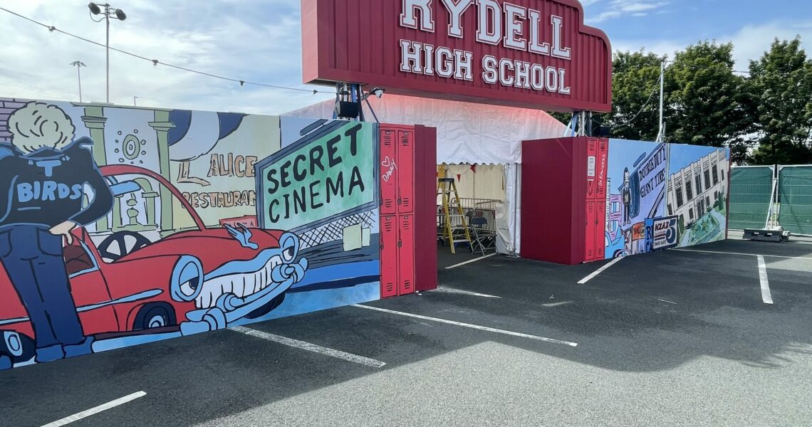 grease the event branded hoarding solution for Secret Cinema