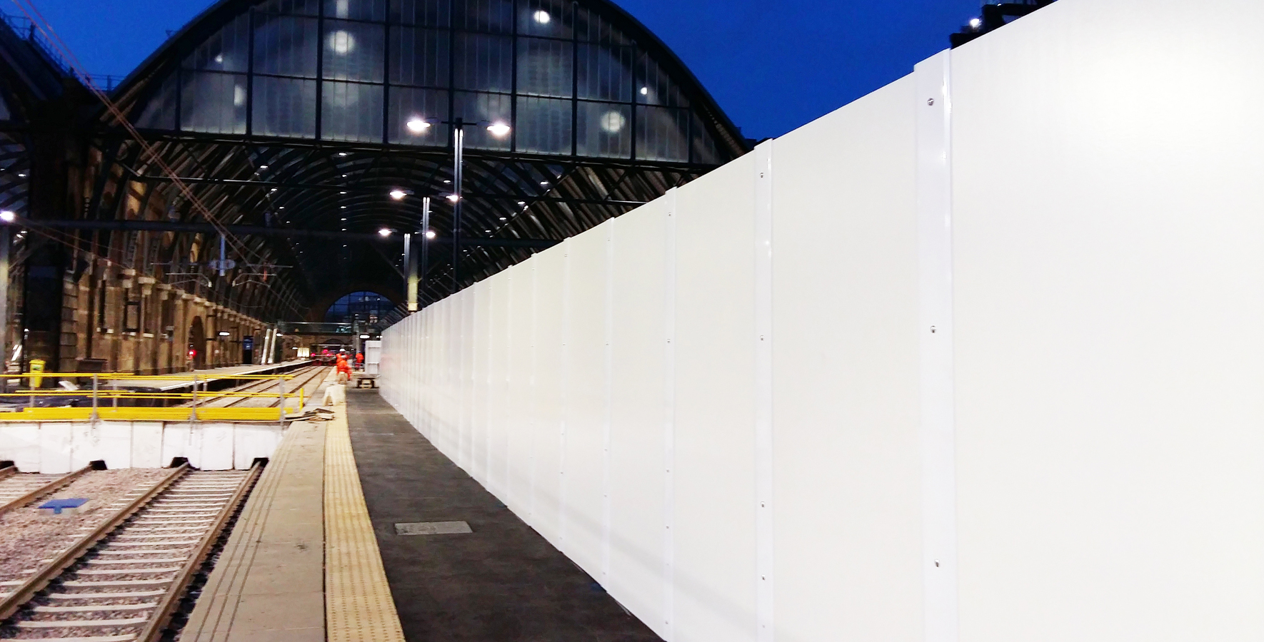 Kings Cross platform redevelopment with hoarding